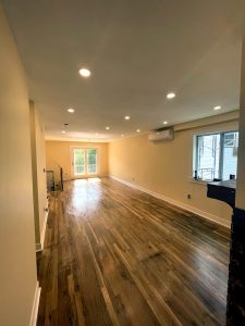 Finished living room with staircase