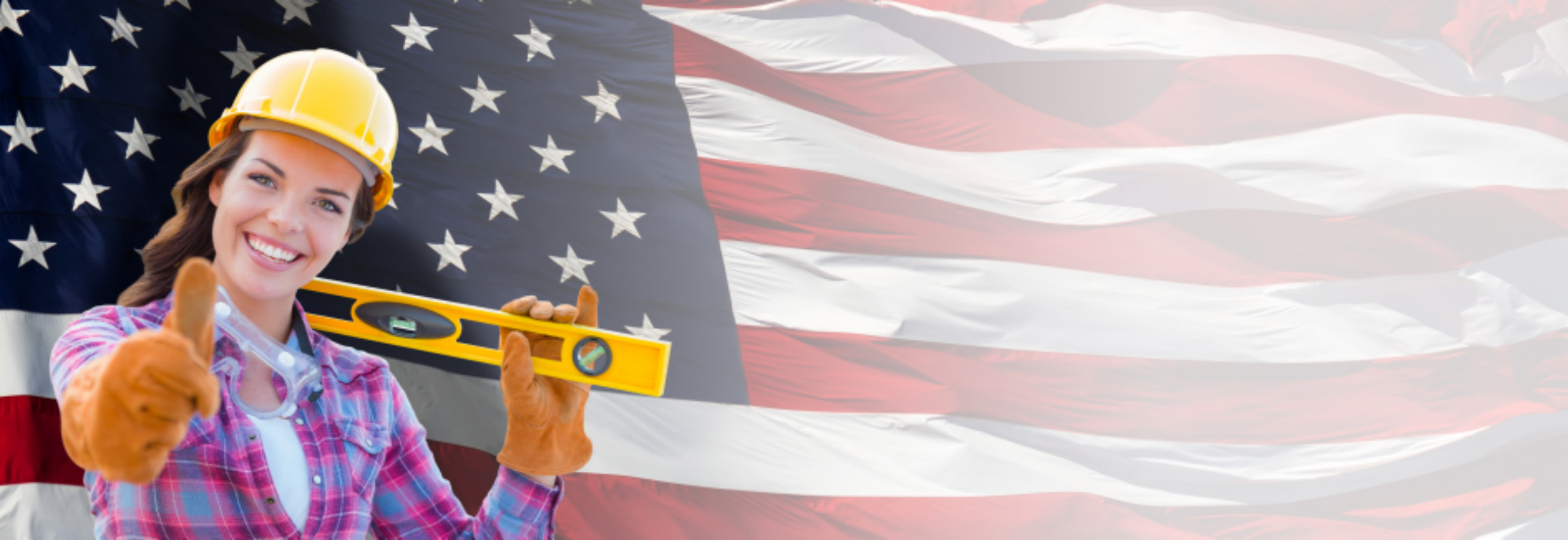 Woman contractor in hard hat with American flag
